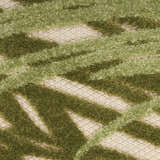 Close-up of the Nourison Aloha Ivory Green Outdoor Area Rug featuring a textured green geometric design.