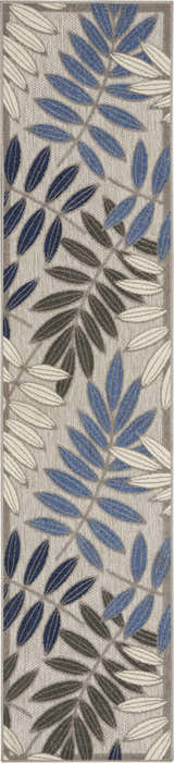 Close-up of the Nourison Aloha Grey Blue Tropical Area Rug featuring a leaf pattern in blue, gray, and white.