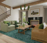 Living room scene with a green Feizy Luna Modern Solid rug, sofa, wicker chairs, and fireplace. Roomscene-Rectangle