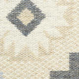 Close-up of the Nourison Copenhagen Ivory Navy rug showing its woven texture and diamond pattern in chestnut, ivory, and navy.