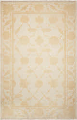Close-up of Nourison Silk Pointe Ivory rug. Vintage style with chestnut floral pattern and handmade wool texture.