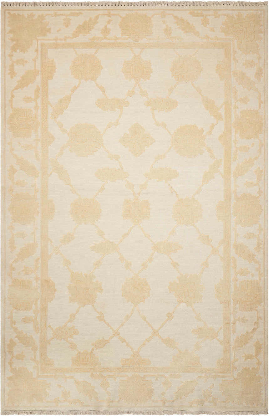 Close-up of Nourison Silk Pointe Ivory rug. Vintage style with chestnut floral pattern and handmade wool texture.