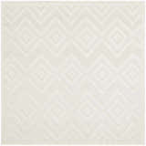 Close-up of a Nourison Versatile Ivory White rug. Features a geometric diamond and chevron pattern with subtle texture.