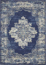 Close-up of the Nourison Grafix Navy Blue Vintage Area Rug. Features a detailed, distressed, central medallion pattern.