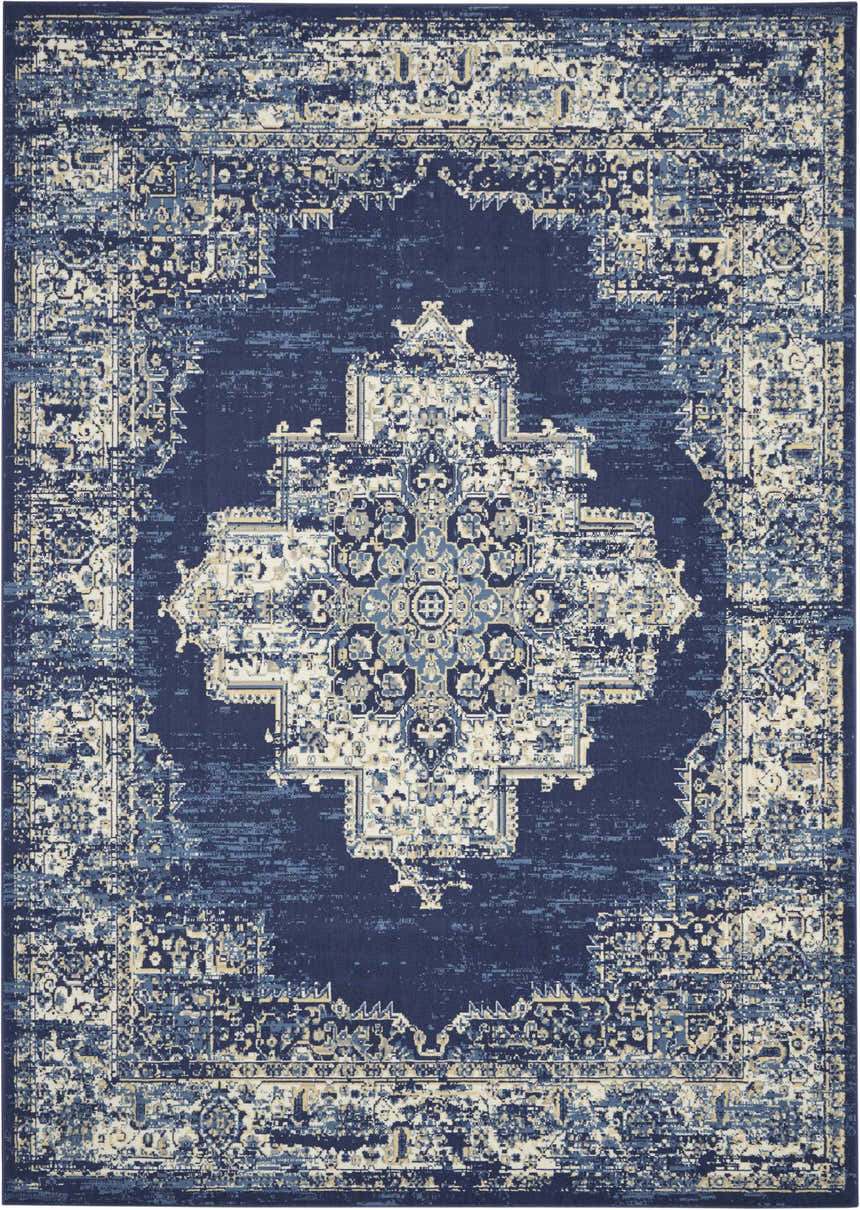 Close-up of the Nourison Grafix Navy Blue Vintage Area Rug. Features a detailed, distressed, central medallion pattern.