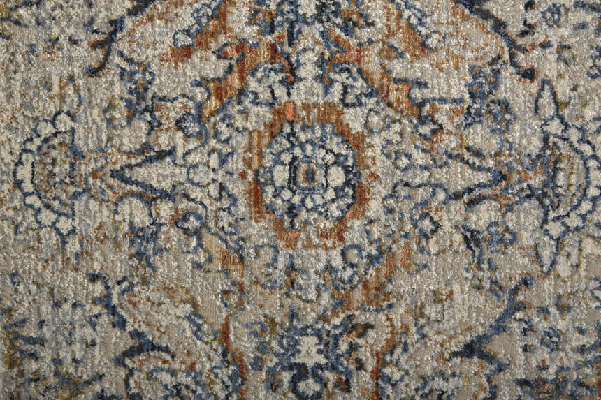 Close-up of the Feizy Kaia rug. Transitional damask pattern in tan, blue, and orange hues. Vintage style rug texture. Texture