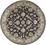Close-up of a round Feizy Eaton rug. Traditional Persian floral design in blue, gray, and taupe wool. Design-Round