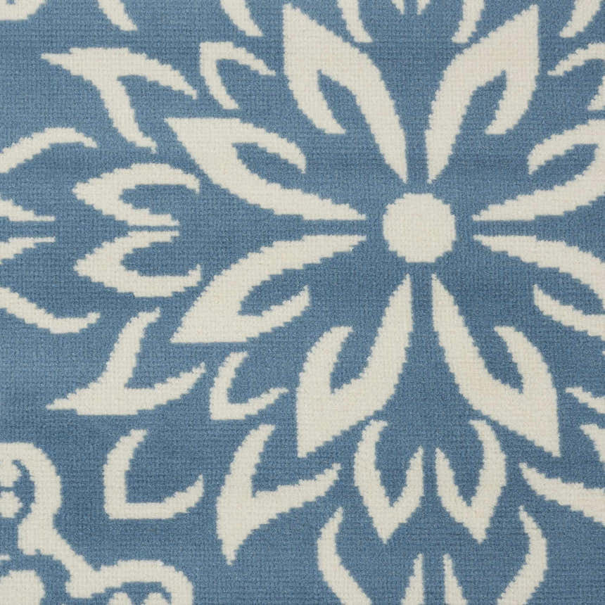 Close up of the Nourison Jubilant Ivory Blue Farmhouse Indoor Area Rug, showing the floral pattern and texture.