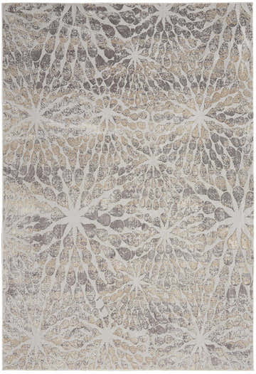 Close-up of Nourison Silky Textures Ivory Beige Rug. Features a modern, starburst pattern in chestnut, beige, and ivory tones.