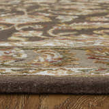 Close-up of Feizy Prescott rug showing brown, tan, and ivory traditional oriental pattern and hand-tufted texture. Pile
