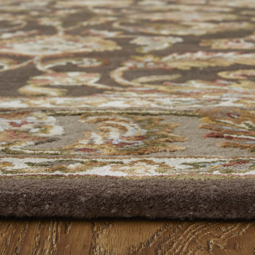 Close-up of Feizy Prescott rug showing brown, tan, and ivory traditional oriental pattern and hand-tufted texture. Pile