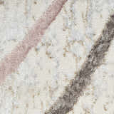 Close-up of the Nourison Glitz Ivory Multicolor rug showing the texture and chestnut, pink, and gray diagonal stripes.