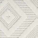 Close-up of the Nourison Versatile Ivory White rug, showing its diamond pattern and textured weave.