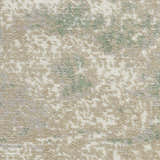 Close-up of Nourison Twilight Ivory Green rug. Abstract chestnut, ivory, and green pattern. Soft, textured wool blend.