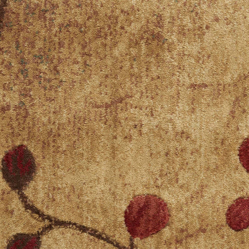 Close-up of the latte-colored Nourison Somerset Rug, showing Southwestern style and red floral accents.
