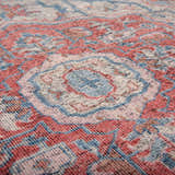 Close up of the hand knotted Rizzy CET723 area rug. Farmhouse style rug with beige, blue, dark red, and ivory colors. Texture