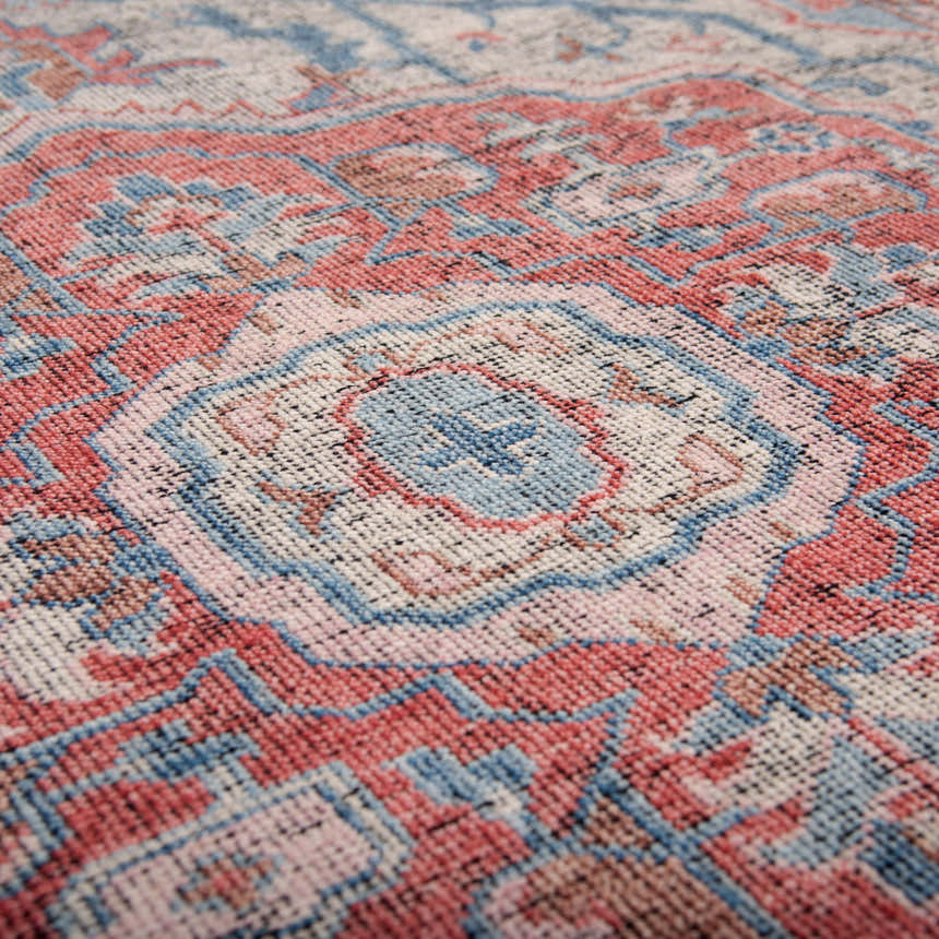 Close up of the hand knotted Rizzy CET723 area rug. Farmhouse style rug with beige, blue, dark red, and ivory colors. Texture
