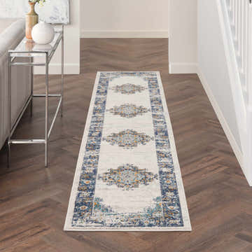 Hallway with Nourison Passion Ivory Grey Blue Vintage Runner Rug on wood floor.