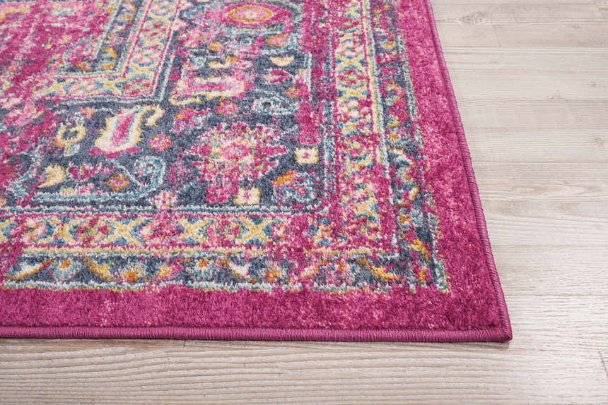 Close-up of Nourison Passion Fuchsia rug showing bohemian design, vibrant colors, and soft texture.
