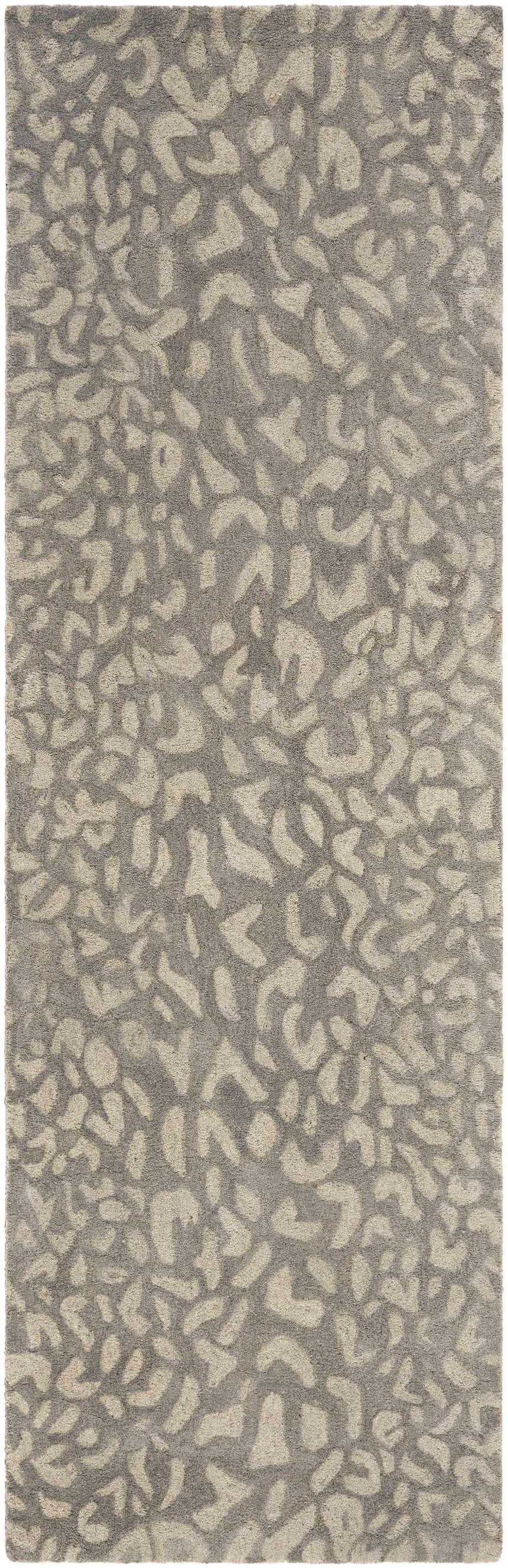 Close-up of the hand-tufted Circa Leopard Print Area Rug, beachhouse and beige tones, 100% wool texture. Design-Runner-268