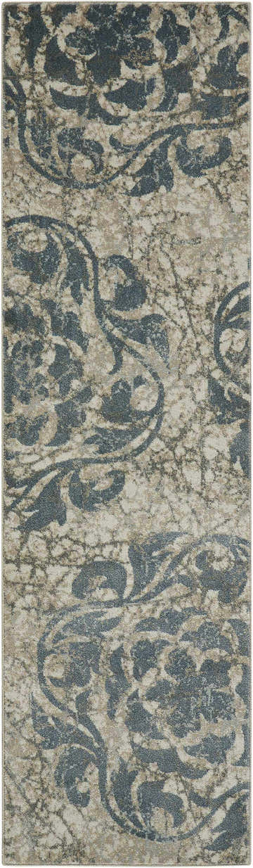Close-up of Nourison Maxell Ivory/Blue rug. Modern rug with a floral, distressed pattern in ivory, blue, and chestnut colors.
