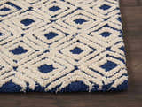 Close-up of the Nourison Deco Mod Navy Ivory rug, featuring a geometric diamond pattern and textured shag pile.