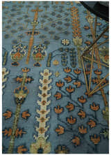 Custom Made Hand Knotted Blue and Rust Tree Design Low pile Wool Area Rug