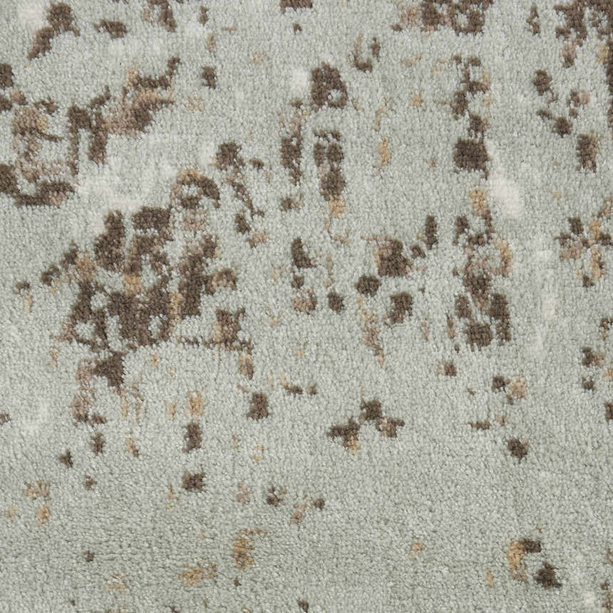 Close-up of the Nourison Euphoria Grey Vintage Area Rug, showing its distressed pattern and soft, textured pile.