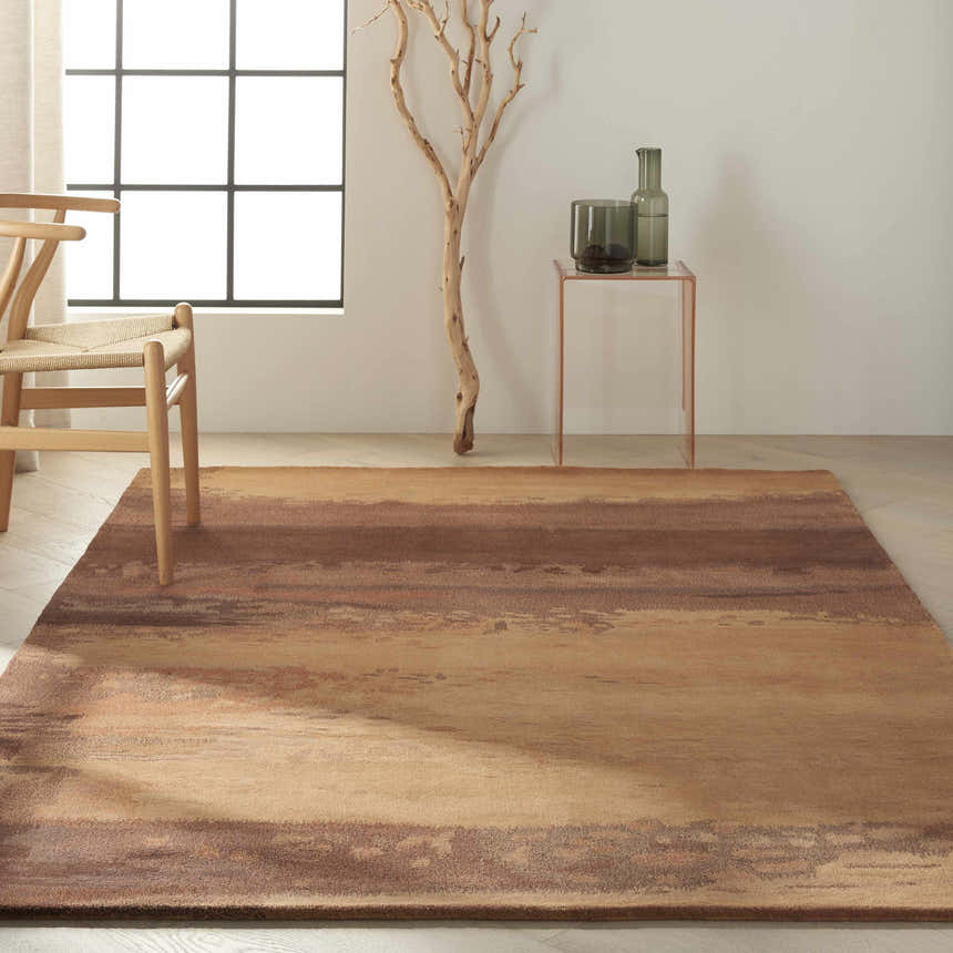 Minimalist room with caramel Calvin Klein Home Luster Wash rug, wood chair, and copper accent table.