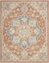 Close-up of Nourison Maison Rust Ivory Vintage Area Rug. Features a chestnut, ivory, and blue floral medallion pattern.