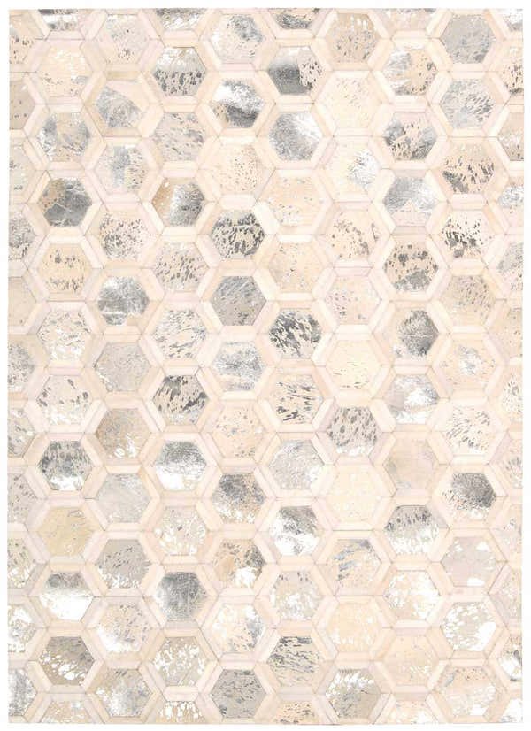 Close-up of the Michael Amini City Chic Snow rug. Features a geometric hexagon pattern in snow white, silver, and beige tones.