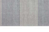 Close-up of the Calvin Klein River Flow grey rug, showing vertical stripes and subtle blue accents.