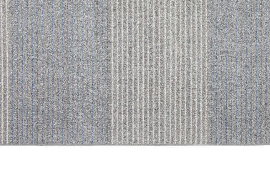 Close-up of the Calvin Klein River Flow grey rug, showing vertical stripes and subtle blue accents.