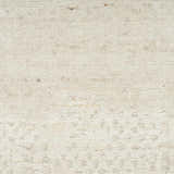 Close up of the ivory Nourison Harmony rug showing its wool and rayon texture and subtle geometric pattern.