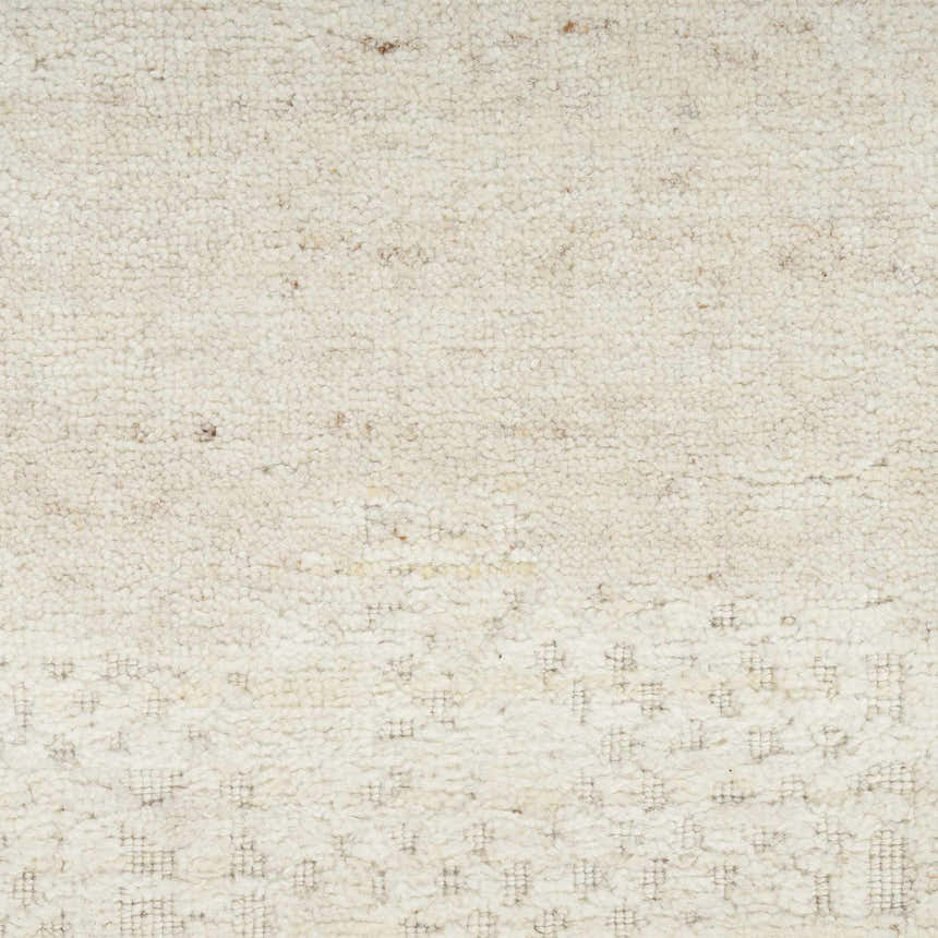 Close up of the ivory Nourison Harmony rug showing its wool and rayon texture and subtle geometric pattern.