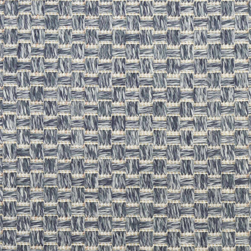 Close-up of the Nourison Tulum Denim Outdoor Area Rug featuring a woven denim and ivory checkered pattern.