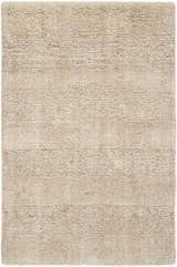 Close-up of the Calvin Klein CK043 Spun Beige rug. Handmade farmhouse style with a textured, neutral wool design.