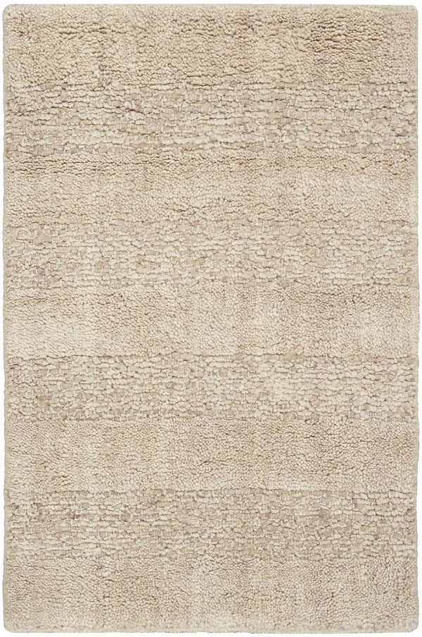 Close-up of the Calvin Klein CK043 Spun Beige rug. Handmade farmhouse style with a textured, neutral wool design.