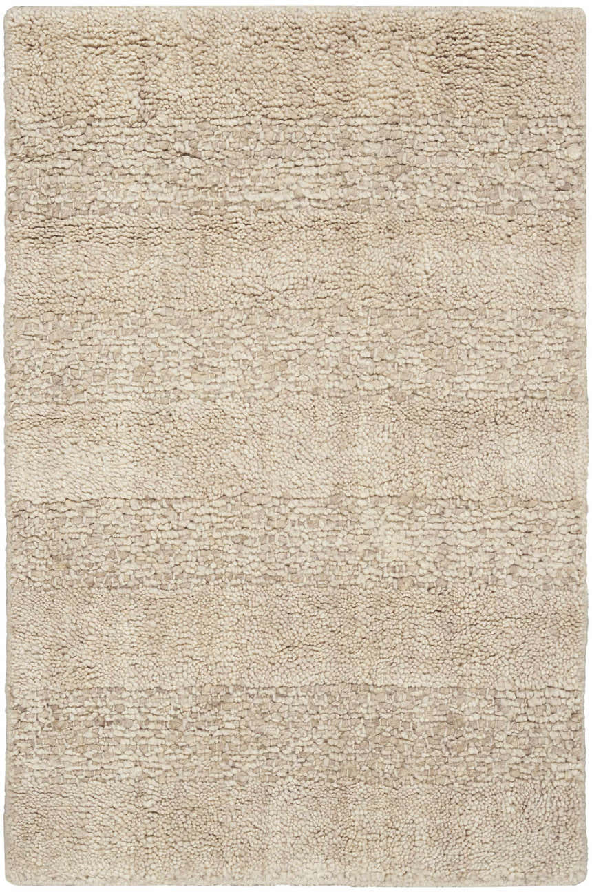 Close-up of the Calvin Klein CK043 Spun Beige rug. Handmade farmhouse style with a textured, neutral wool design.