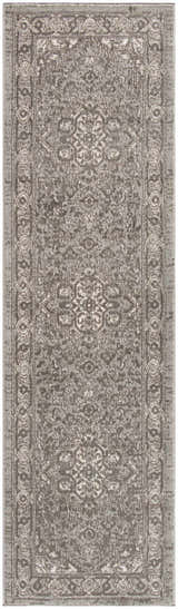 Close-up of the grey Nourison Quarry rug featuring a vintage, distressed design and high pile texture.