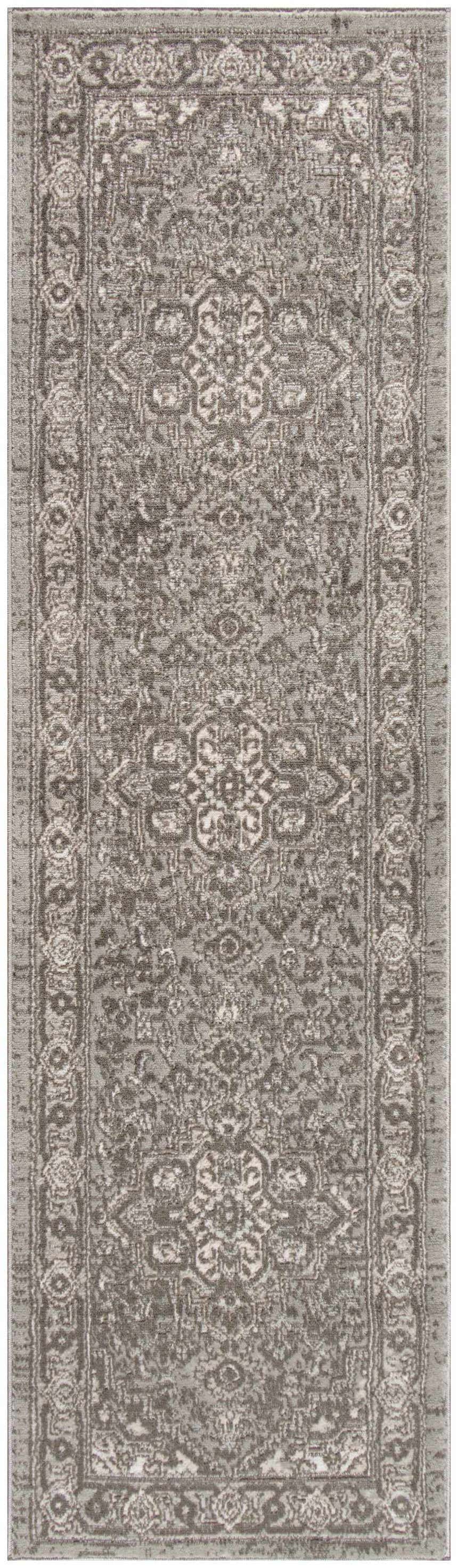 Close-up of the grey Nourison Quarry rug featuring a vintage, distressed design and high pile texture.