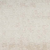 Close-up of the ivory Nourison Serenity Home rug. High pile texture in a subtle, modern design with chestnut undertones.