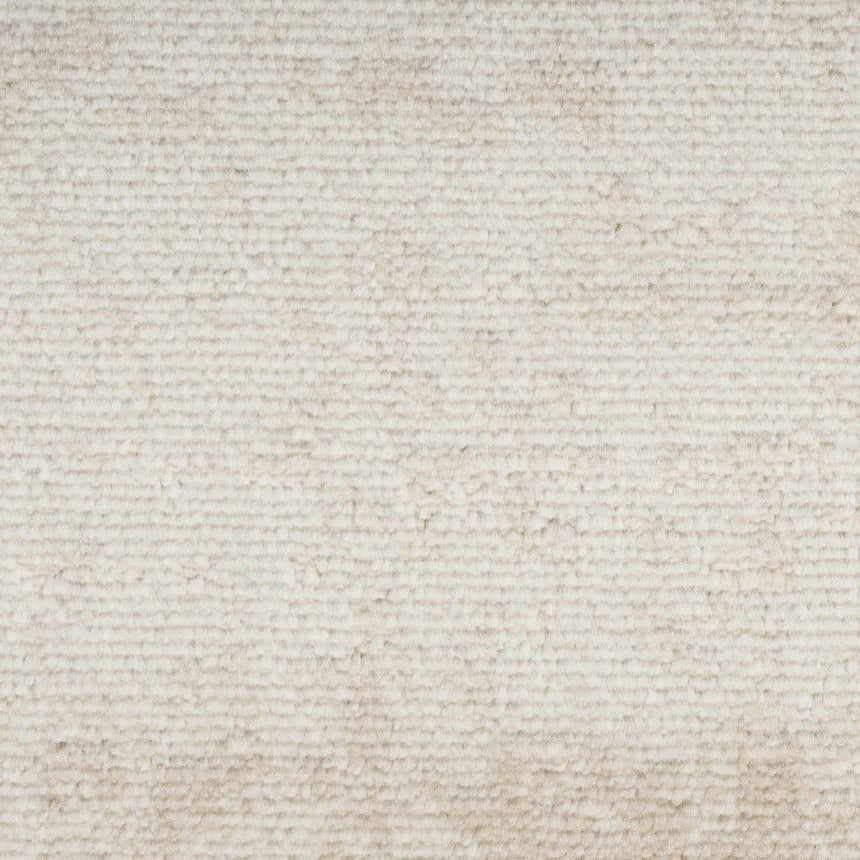 Close-up of the ivory Nourison Serenity Home rug. High pile texture in a subtle, modern design with chestnut undertones.