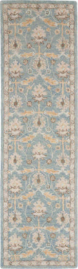 Close-up of Nourison Jazmine Blue Persian rug. Light blue wool rug with beige and brown floral pattern. Handmade rug.