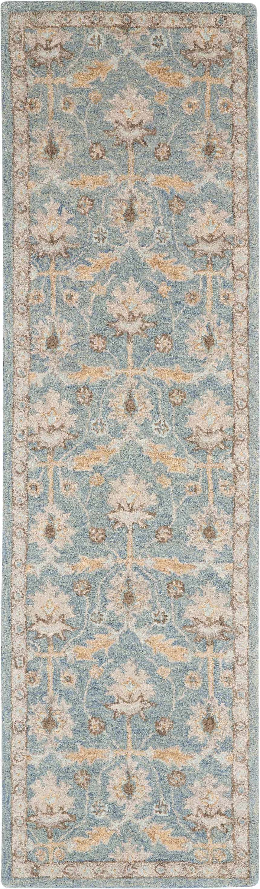 Close-up of Nourison Jazmine Blue Persian rug. Light blue wool rug with beige and brown floral pattern. Handmade rug.