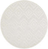 Close-up of a round Nourison Versatile Ivory White rug. The rug has a geometric diamond pattern and a subtle texture.
