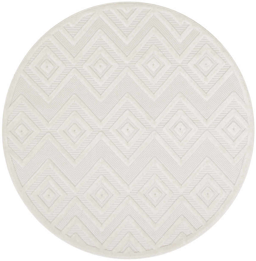 Close-up of a round Nourison Versatile Ivory White rug. The rug has a geometric diamond pattern and a subtle texture.