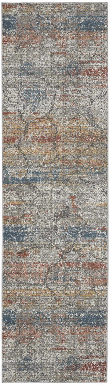Close-up of Nourison Rustic Textures Multicolor rug. Modern design with blue, rust, and gold hues on a textured gray base.