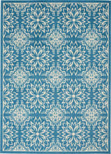 Close-up of Nourison Jubilant Ivory Blue Farmhouse rug featuring a floral medallion pattern.