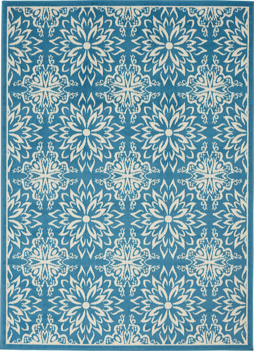 Close-up of Nourison Jubilant Ivory Blue Farmhouse rug featuring a floral medallion pattern.